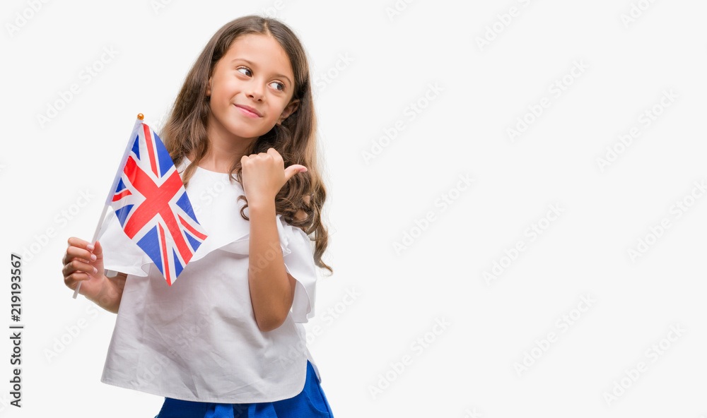 hispanic girl holding flag of United Kingdom pointing and
