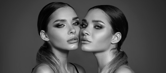 Portrait of two attractive women in glamour makeup.