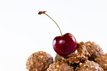 Wall Mural - Cherry and Chocolate, Sweet chocolate mixed hazelnut and walnut on white background
