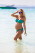 © Youlaangel - Charming pregnant woman in a swimsuit on the background of the ocean