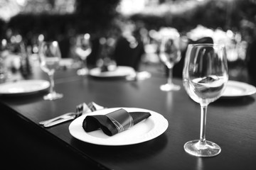 Wall Mural - Sparkling glassware stands on long table prepared for wedding dinner.