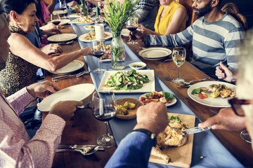 Group of diverse friends are having a dinner together