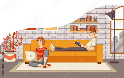 Young couple reading book and using laptop on sofa in the living room