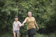 © Johnstocker - Grandmother Playing With Granddaughter Outdoors At The Park