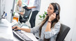 © Bojan - Portrait of beautiful female friendly customer representative with headset smiling during a online telephone conversation with customer.