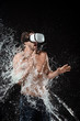 © LIGHTFIELD STUDIOS - shirtless man in vr headset swilled with water isolated on black