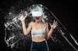 © LIGHTFIELD STUDIOS - portrait of emotional woman in vr headset swilled with water isolated on black