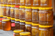 Pile of honey jars at street market
