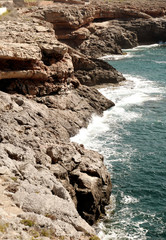 Wall Mural - Waves hitting the rocks on the seashore