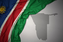 Waving Colorful National Flag And Map Of Namibia.