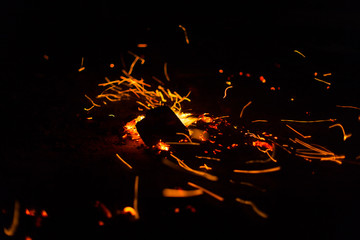 Flame of fire with sparks on a black background