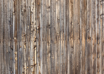 Wall Mural - Natural old vintage weathered brown solid wooden fence. Abstract copy space background.