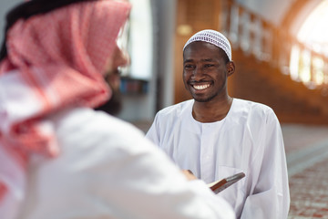 Poster - Two religious muslim man praying together inside the mosque