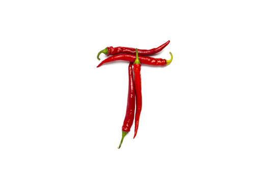 Red hot chili pepper lined in the letter T on a white background