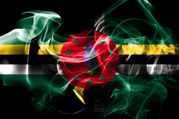 National flag of Dominica made from colored smoke isolated on black background