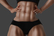 © PixlMakr - Female with six pack on grey background