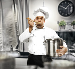 Wall Mural - Cook chef in kitchen and free space for your decoration. 