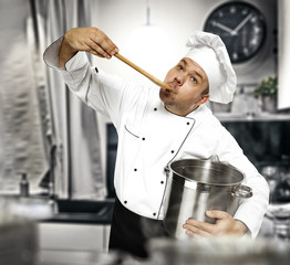 Wall Mural - Cook chef in kitchen and free space for your decoration. 