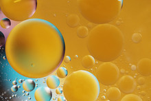 Abstract Oil Balls Of Water Drops Of Yellow And Blue Color