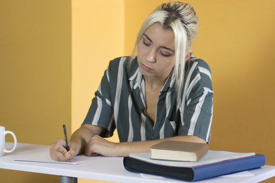 young girl writing in the office