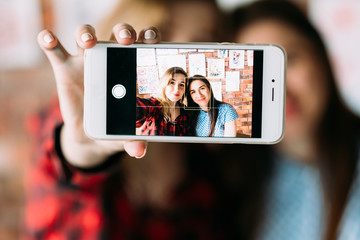 Wall Mural - art painting blog. creative leisure. artist and her student take selfie in a workshop to share on the internet.