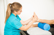 © AntonioDiaz - Physiotherapy Professional Massaging Patient's Foot