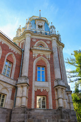 Tower of Great Palace in Museum-reserve Tsaritsyno in Moscow against blue sky at sunny summer morning