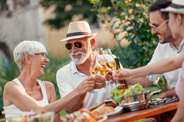 Sticker - Family having barbecue party in backyard