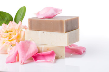 Poster - Handmade soap with flower petals on white background