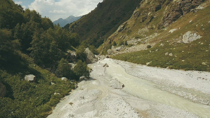 Wall Mural - top view mountain river. hiking group walking along mountain river