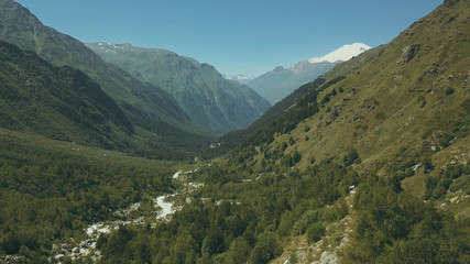 Wall Mural - aerial shooting from flying drone mountain forest. high mountain top view