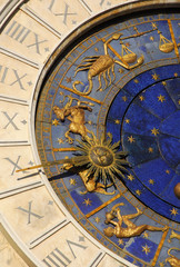 ancient time, astrology and horoscope. detail of saint mark square old clocktower with zodiac signs 