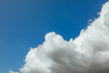 deep blue sky with big fluffy white cloud