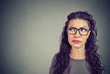 © pathdoc - Closeup of a thoughtful young woman in glasses looking up contemplating