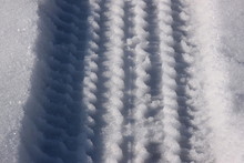 Close Up Of Tire Marks In The Snow