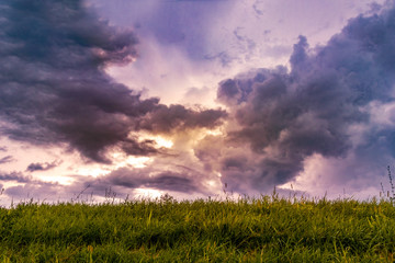 vibrant mid-western sunset through dramatic storm clouds.