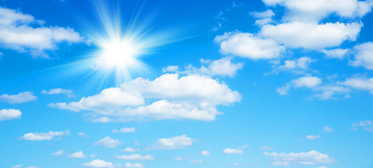 Wall Mural - sunny background, blue sky with white clouds and sun