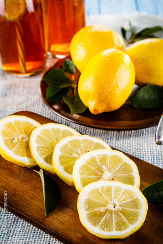 lemons-on-cutting-board-on-wooden-table