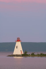 Fototapete - Kidston Island Lighthouse at sunset in Baddeck, Nova Scotia