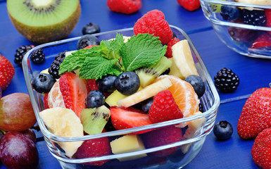 Wall Mural - Colorful fresh fruit salad in a bowls