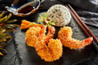 Three prawn tails fried in crispy tempura batter