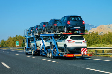 Wall Mural - Car carrier at road