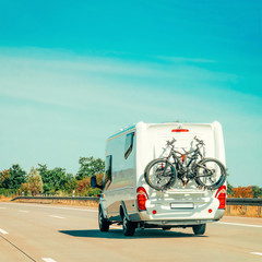 Sticker - RV Camper Car with bicycles on Road at Switzerland