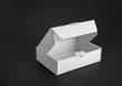 © OttoPles - Cardboard paper box on a black background