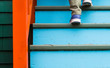 Walking up stairs on a colorful house