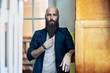 © GVS - Portrait of bearded thoughtful man strokes beard