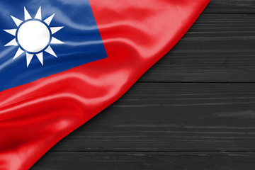 Wall Mural - Flag of Taiwan and place for text on a dark wooden background