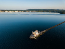 The Rockland Breakwater Lighthouse At The End Of The Mile Long Breakwater In Rockland Maine As Viewed Via An Aerial Drone Image In The Mornng Light