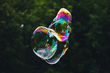 soap bubbles abstract shape, green background