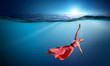 © Sergey Nivens - Woman dancer in clear blue water